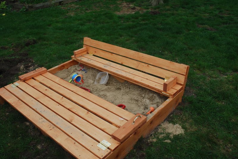 Sand box with built-in seats