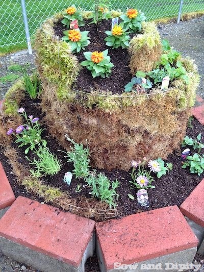 Spiral Herb Garden From Recycled Materials and Moss