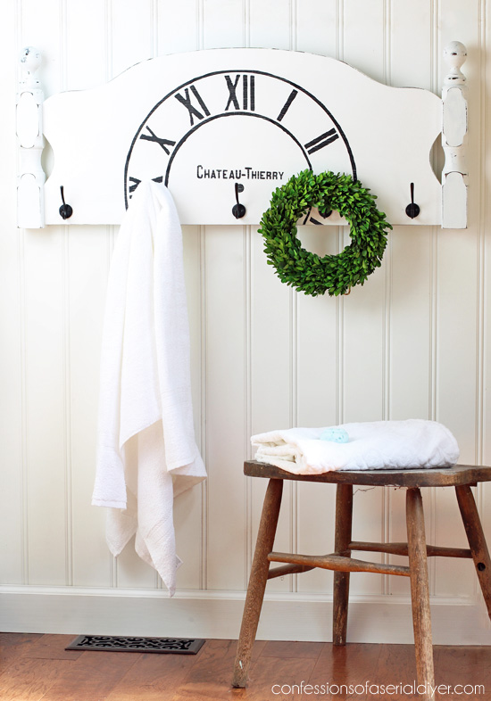 Turn an old headboard into a charming place to hang your coats or towels!